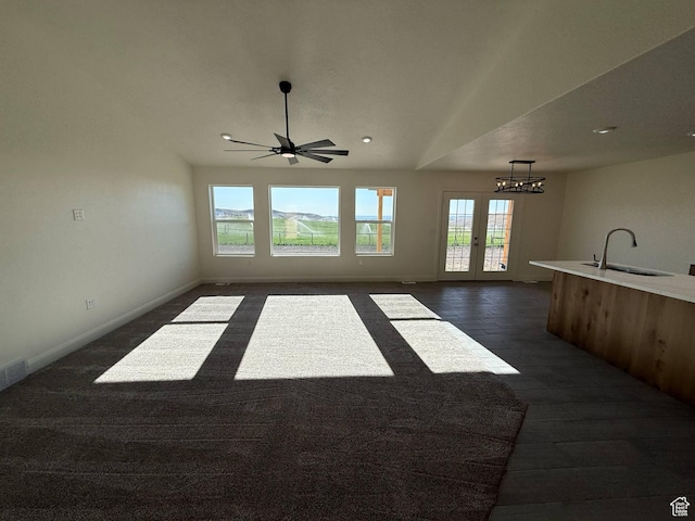 1030 N 200 E, Ferron, UT 84523 - unfurnished living room with a sink, plenty of natural light, a chandelier, baseboards, and recessed lighting