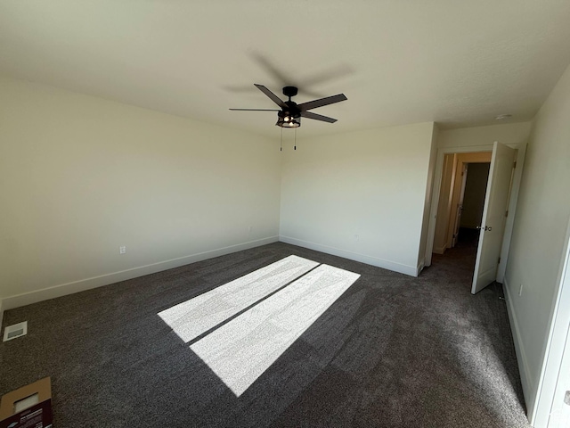 1030 N 200 E, Ferron, UT 84523 - unfurnished room featuring dark carpet, ceiling fan, and baseboards