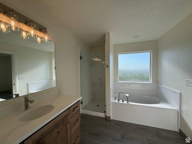 1030 N 200 E, Ferron, UT 84523 - full bath featuring vanity, a shower stall, a garden tub, and a textured ceiling