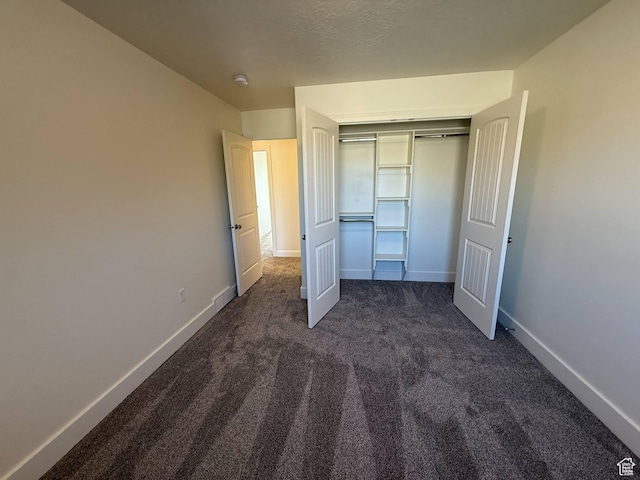 1030 N 200 E, Ferron, UT 84523 - unfurnished bedroom with dark colored carpet, baseboards, and a closet