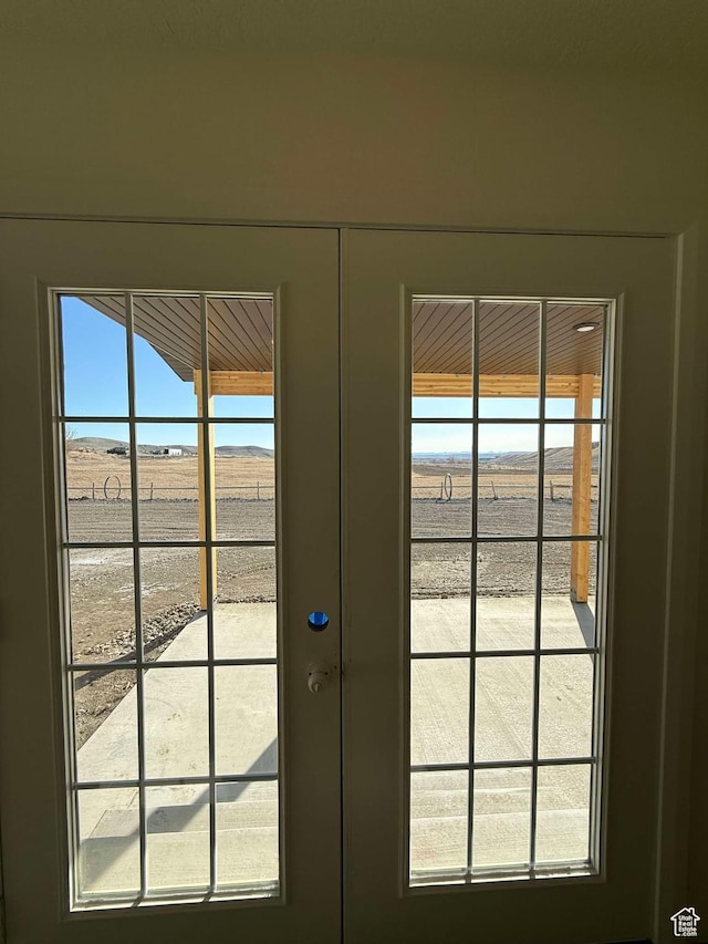doorway to outside with a mountain view