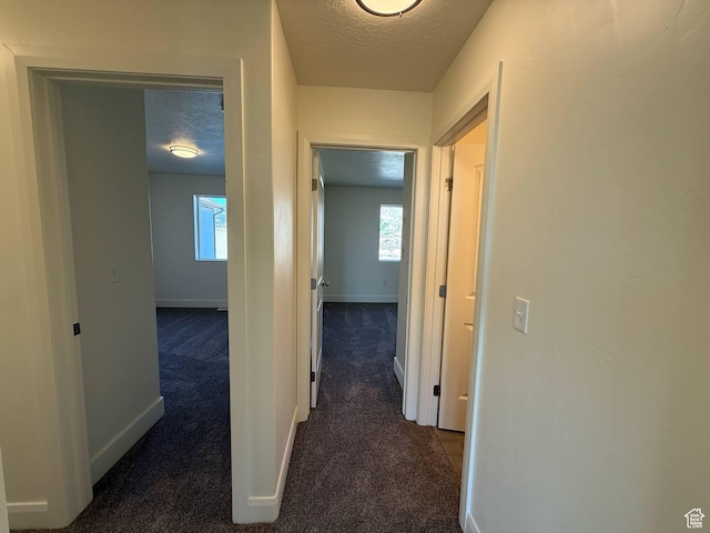1030 N 200 E, Ferron, UT 84523 - hall featuring a textured ceiling, carpet, and baseboards