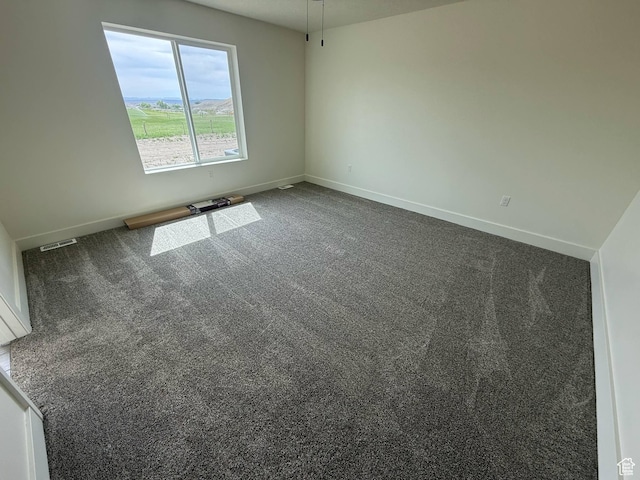 1030 N 200 E, Ferron, UT 84523 - unfurnished room featuring baseboards and dark carpet