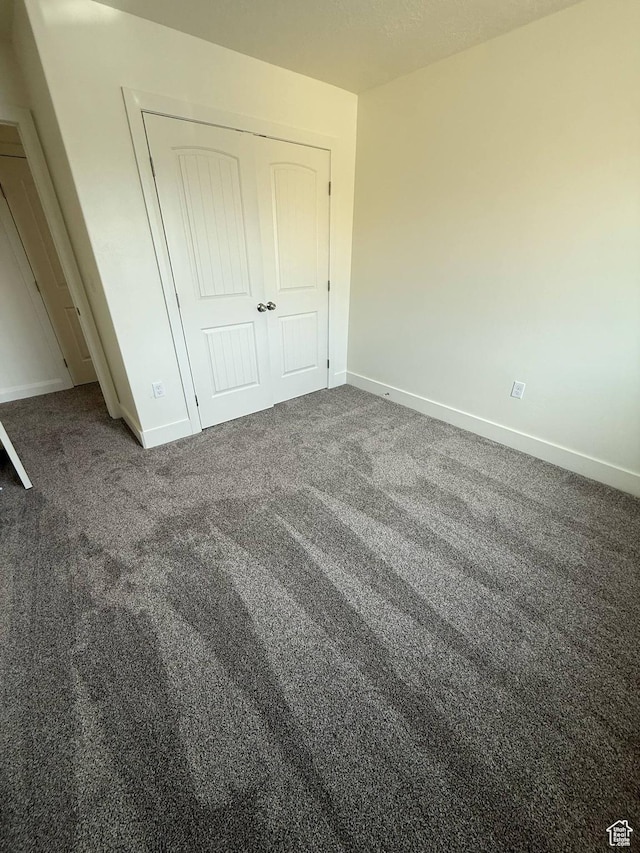 1030 N 200 E, Ferron, UT 84523 - unfurnished bedroom with carpet floors, baseboards, and a closet