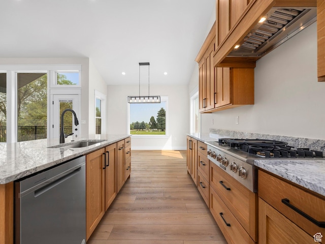 0, Preston, ID 83263 - kitchen featuring custom exhaust hood, sink, a kitchen island with sink, appliances with stainless steel finishes, and light stone countertops