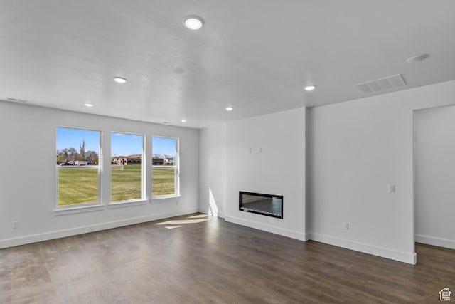 412 W 3085 S, Nibley, UT 84321 - unfurnished living room featuring baseboards, visible vents, recessed lighting, and dark wood-style floors