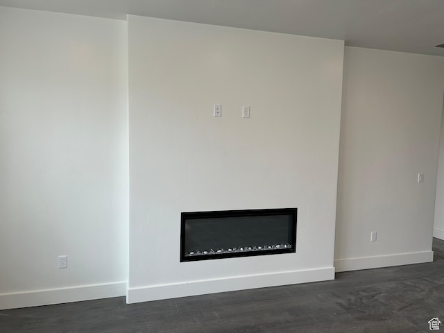 412 W 3085 S, Nibley, UT 84321 - details with baseboards, wood finished floors, and a glass covered fireplace