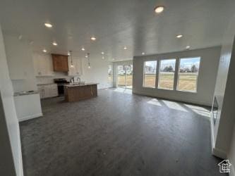 412 W 3085 S, Nibley, UT 84321 - unfurnished living room with recessed lighting