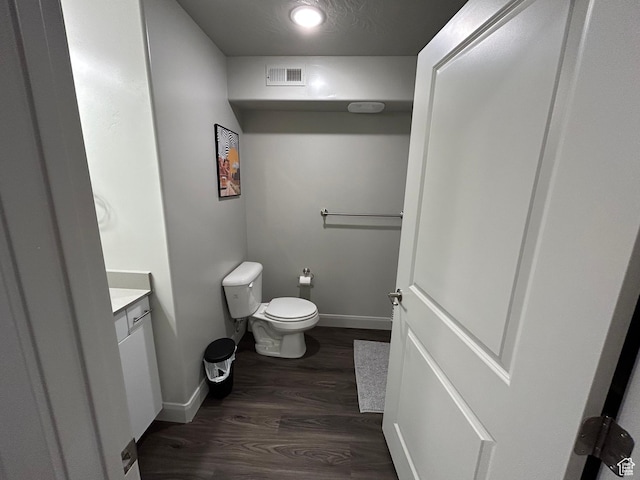 128 N Lone Rock Dr Unit A105, Hurricane, UT 84737 - bathroom featuring visible vents, baseboards, toilet, wood finished floors, and vanity