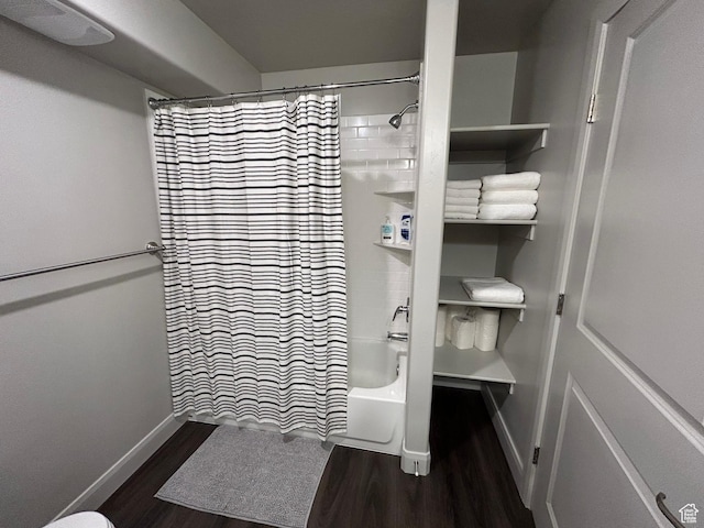 128 N Lone Rock Dr Unit A105, Hurricane, UT 84737 - full bath featuring shower / bathtub combination with curtain, wood finished floors, and baseboards