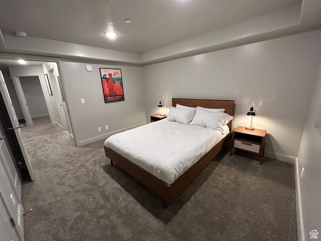 128 N Lone Rock Dr Unit A105, Hurricane, UT 84737 - bedroom featuring a raised ceiling, baseboards, and carpet floors