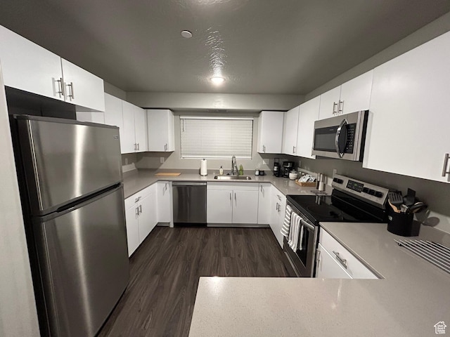 128 N Lone Rock Dr Unit A105, Hurricane, UT 84737 - kitchen featuring dark wood-style flooring, appliances with stainless steel finishes, white cabinetry, and a sink
