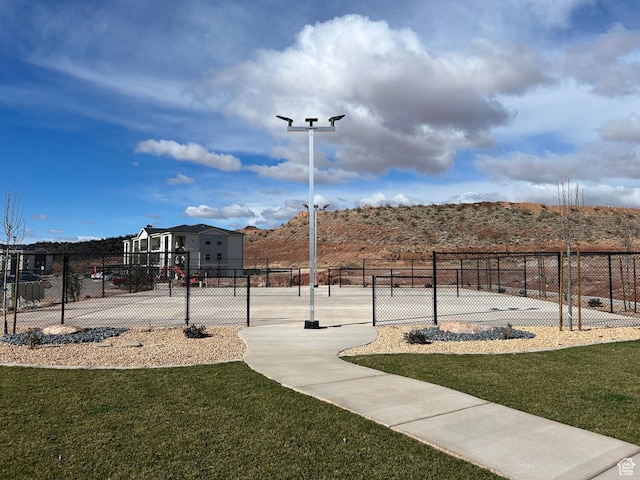 128 N Lone Rock Dr Unit A105, Hurricane, UT 84737 - view of property's community with community basketball court, a yard, and fence