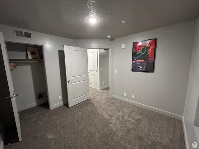 128 N Lone Rock Dr Unit A105, Hurricane, UT 84737 - unfurnished bedroom featuring baseboards, visible vents, carpet floors, a closet, and a textured ceiling
