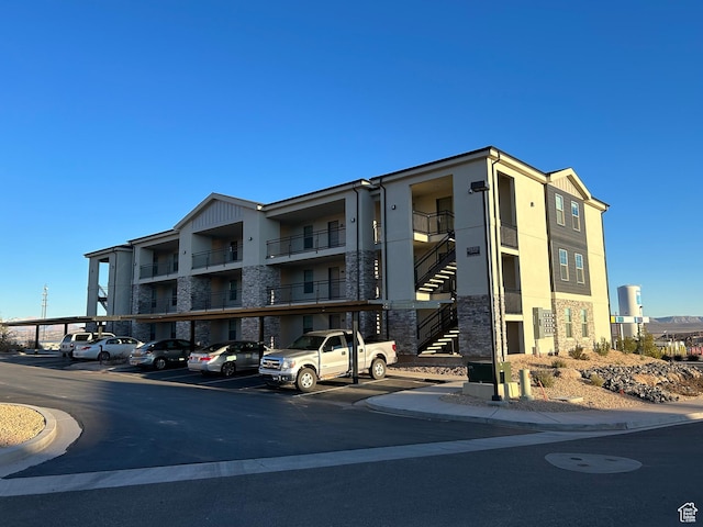 128 N Lone Rock Dr Unit A105, Hurricane, UT 84737 - view of property with stairway and covered parking