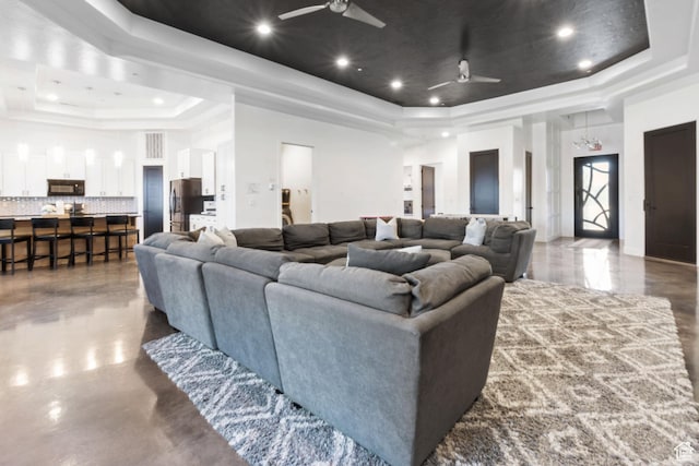 3243 S Hideaway Pl, Hurricane, UT 84737 - home theater room with ceiling fan, a raised ceiling, a towering ceiling, and concrete flooring