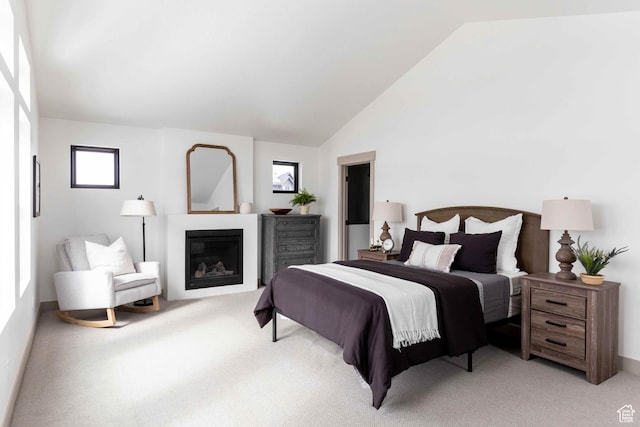 6968 Elk Wallow Dr, Park City, UT 84098 - bedroom featuring a glass covered fireplace, lofted ceiling, and light colored carpet
