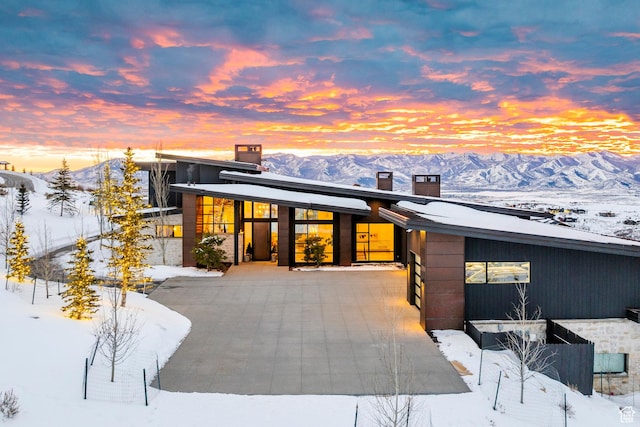 9491 N Promontory Summit Dr, Park City, UT 84098 - contemporary house featuring a mountain view and a chimney