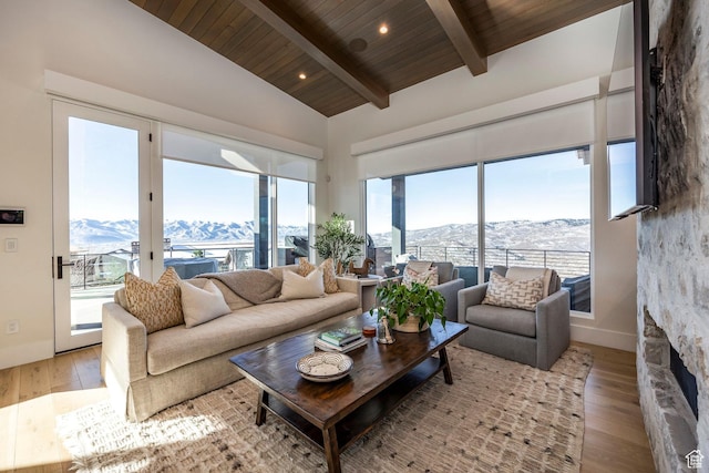 9491 N Promontory Summit Dr, Park City, UT 84098 - living area featuring light wood-style floors, wood ceiling, a mountain view, and beamed ceiling