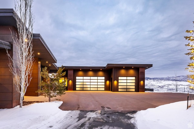 9491 N Promontory Summit Dr, Park City, UT 84098 - view of front facade featuring a garage and a mountain view