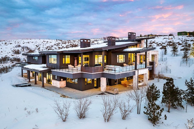 9491 N Promontory Summit Dr, Park City, UT 84098 - snow covered back of property featuring stucco siding