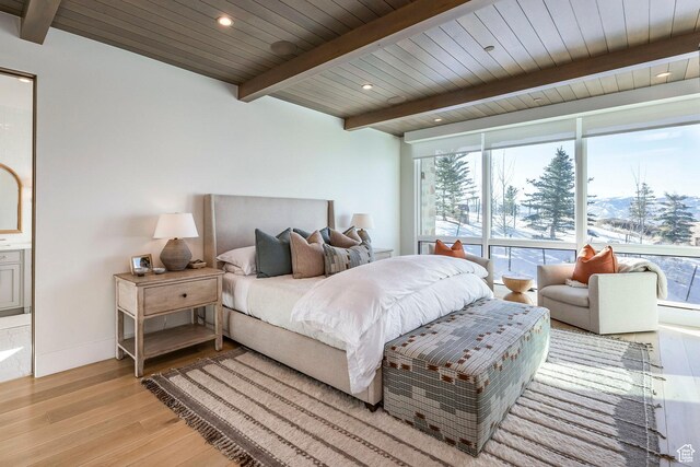 9491 N Promontory Summit Dr, Park City, UT 84098 - bedroom featuring baseboards, wood ceiling, beamed ceiling, light wood-style floors, and recessed lighting
