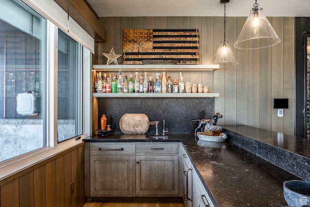 9491 N Promontory Summit Dr, Park City, UT 84098 - bar featuring hanging light fixtures, wood walls, indoor bar, and backsplash