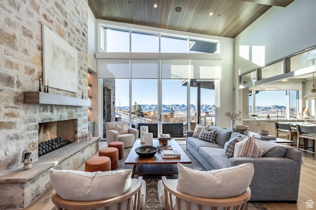 9491 N Promontory Summit Dr, Park City, UT 84098 - living room featuring wooden ceiling, a fireplace, a mountain view, and wood finished floors