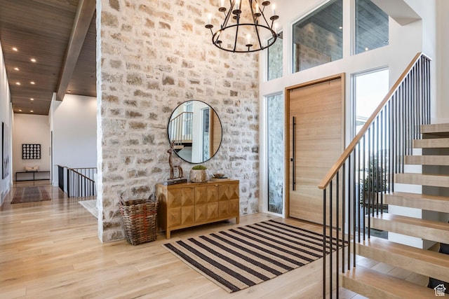 9491 N Promontory Summit Dr, Park City, UT 84098 - foyer with a chandelier, a towering ceiling, light wood-style flooring, and recessed lighting