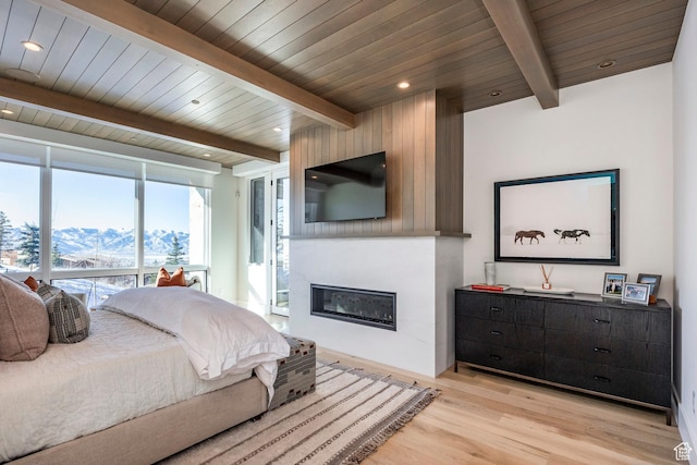 9491 N Promontory Summit Dr, Park City, UT 84098 - bedroom featuring light wood finished floors, wood ceiling, a fireplace, and beamed ceiling