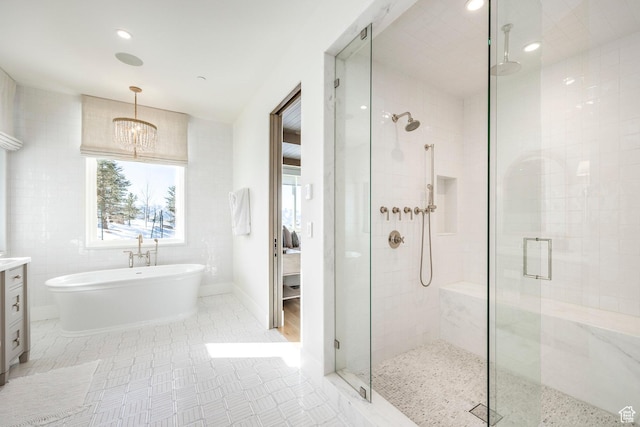 9491 N Promontory Summit Dr, Park City, UT 84098 - full bathroom featuring a freestanding tub, recessed lighting, tile walls, vanity, and a stall shower