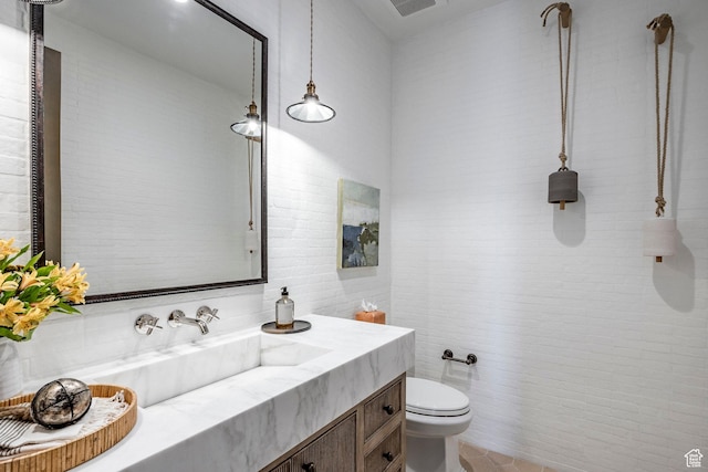 9491 N Promontory Summit Dr, Park City, UT 84098 - bathroom featuring toilet, visible vents, vanity, and tile walls