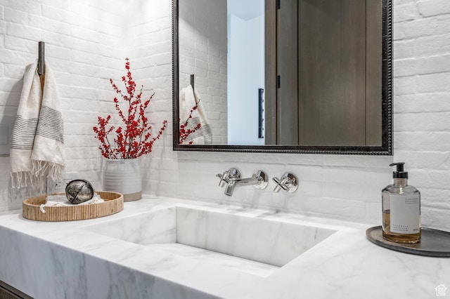 9491 N Promontory Summit Dr, Park City, UT 84098 - bathroom featuring brick wall and vanity