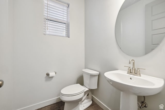 2344 N White Cliff Dr, Lehi, UT 84043 - bathroom with a sink, wood finished floors, toilet, and baseboards