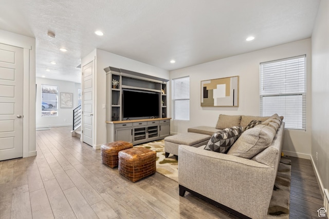 2344 N White Cliff Dr, Lehi, UT 84043 - living area with recessed lighting, baseboards, stairway, and light wood finished floors
