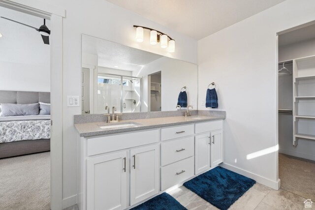 2344 N White Cliff Dr, Lehi, UT 84043 - bathroom with a sink, a spacious closet, ensuite bath, and double vanity