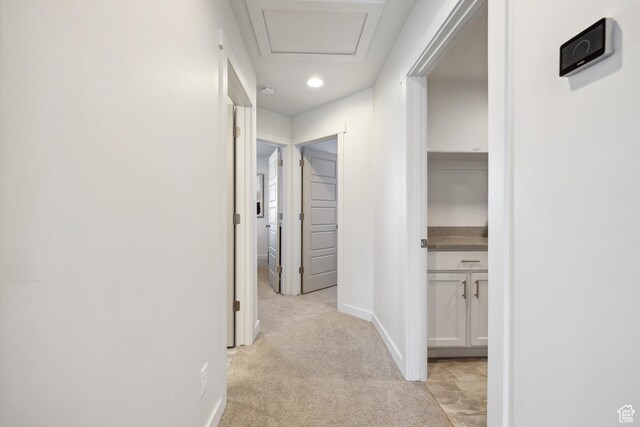 2344 N White Cliff Dr, Lehi, UT 84043 - hallway with attic access, light carpet, and baseboards