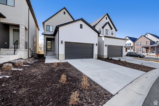 modern farmhouse featuring central air condition unit and concrete driveway