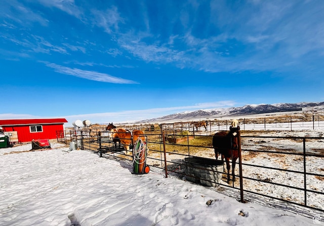 23711 W 12500 S, Stone, ID 83252 - yard covered in snow featuring a mountain view, a rural view, and an outdoor structure