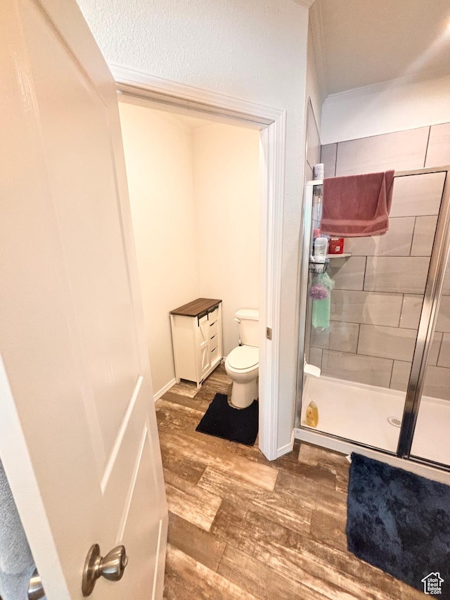 23711 W 12500 S, Stone, ID 83252 - bathroom with hardwood / wood-style flooring, toilet, and walk in shower