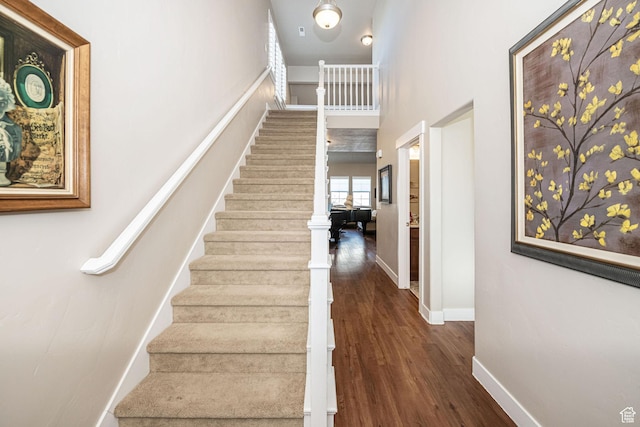 1206 W Holt Farm Ln, South Jordan, UT 84095 - stairway featuring hardwood / wood-style floors and a towering ceiling