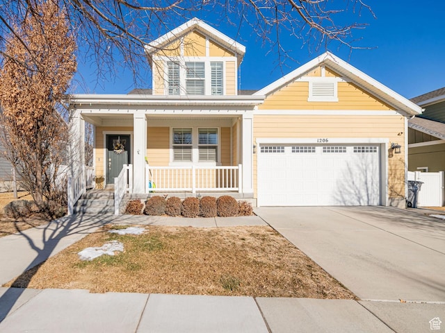 1206 W Holt Farm Ln, South Jordan, UT 84095 - view of front facade featuring a garage and covered porch