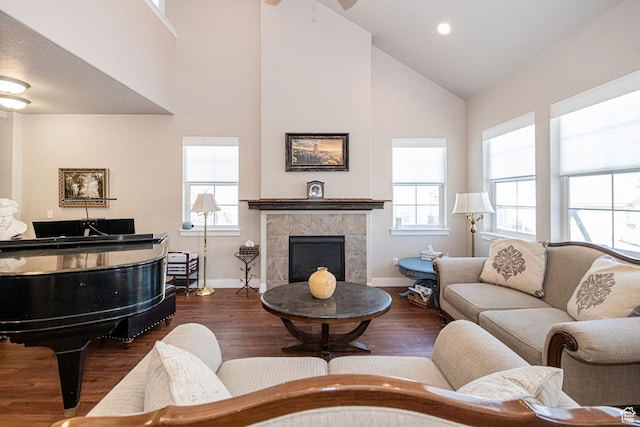 1206 W Holt Farm Ln, South Jordan, UT 84095 - living room with a tiled fireplace, dark hardwood / wood-style floors, and a wealth of natural light