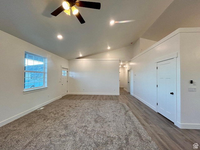 spare room featuring ceiling fan, dark hardwood / wood-style floors, and lofted ceiling