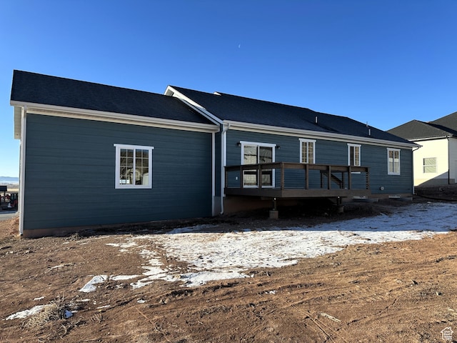 rear view of house featuring a deck