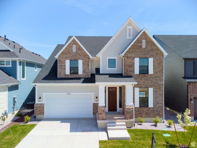 craftsman-style house featuring a garage, brick siding, roof with shingles, and concrete driveway
