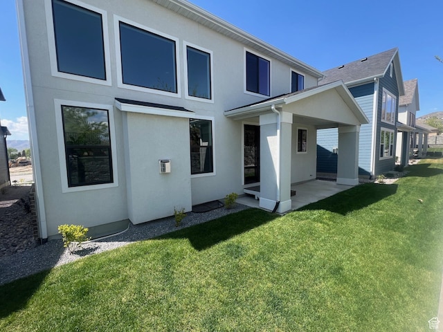 2946 N 1080 W, Lehi, UT 84043 - back of property with stucco siding, a yard, and a patio area