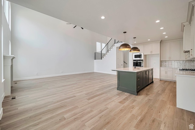 2946 N 1080 W, Lehi, UT 84043 - kitchen featuring visible vents, light wood-style floors, recessed lighting, light countertops, and backsplash