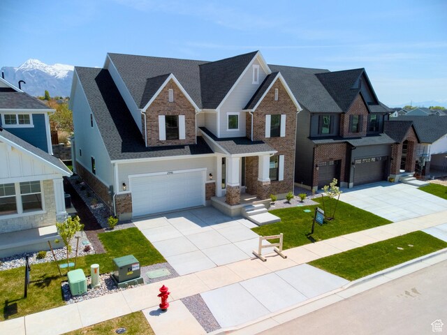 2946 N 1080 W, Lehi, UT 84043 - traditional-style house featuring concrete driveway, brick siding, an attached garage, and roof with shingles