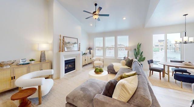 1502 S 380 E Unit 54, Salem, UT 84653 - living area featuring lofted ceiling, light wood-type flooring, plenty of natural light, a fireplace with flush hearth, and a chandelier